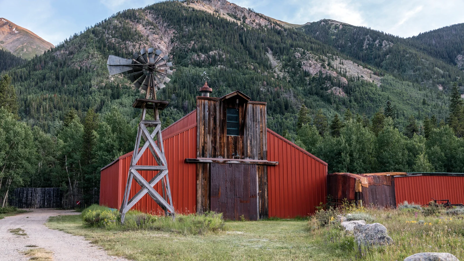 A red barn and windmill at a ranch near Twin Lakes, at the base of Mount Elbert in Lake County, Colorado.