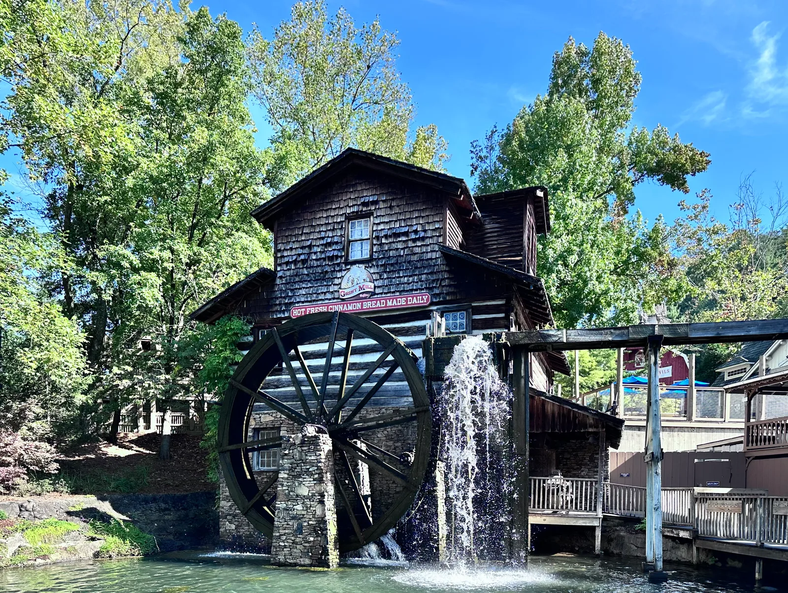 Wooden Grist Mill and water wheel beside the cinnamon bread shop at Dollywood