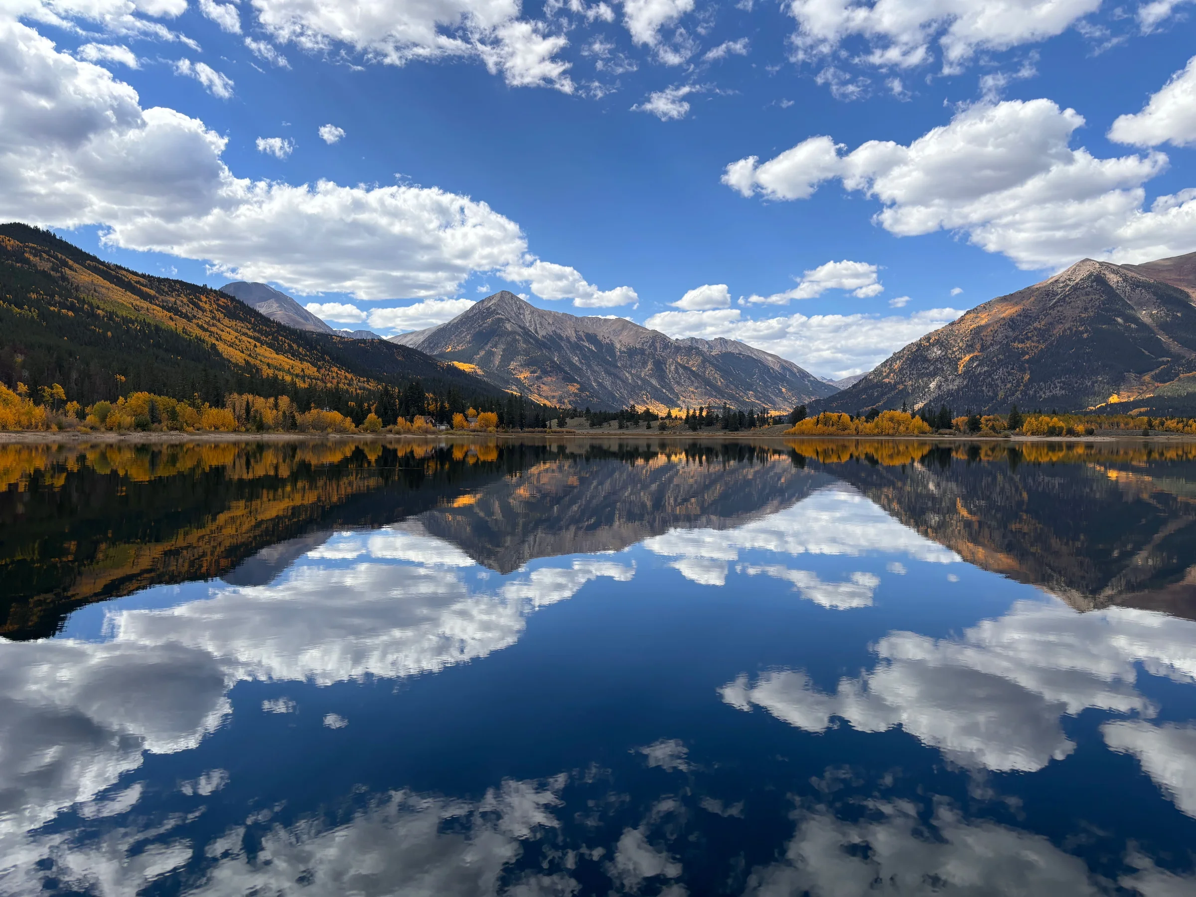 Twin Lakes mirroring golden aspens and the Sawatch peaks on a still fall morning
