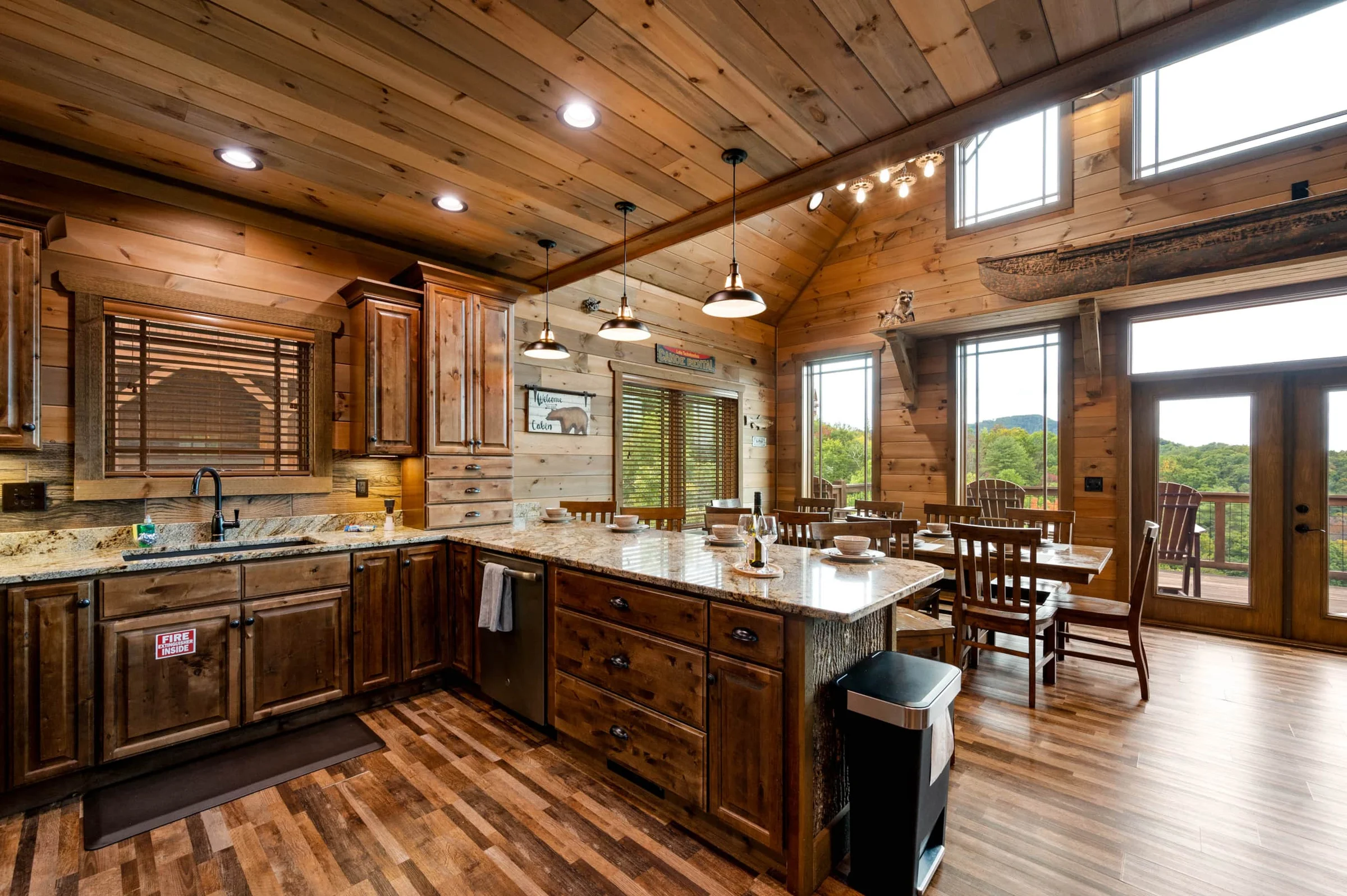 Rustic kitchen with granite island and dining area